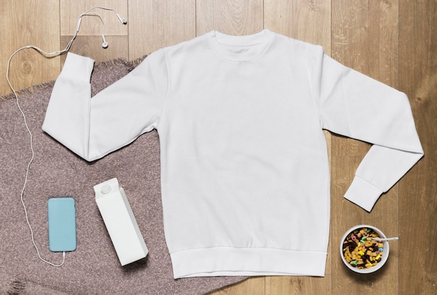 Hoodie and bowl with cereals and milk beside