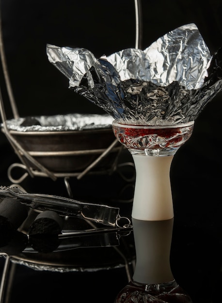 hookah bowl and clipper in dark background