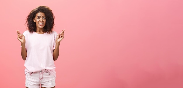 Free photo hope she gets positive result portrait of worried intense hopeful goodlooking young african american