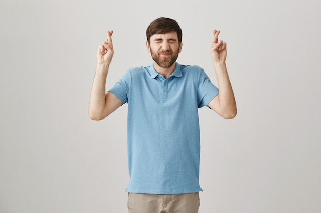 Hopeful young bearded man posing