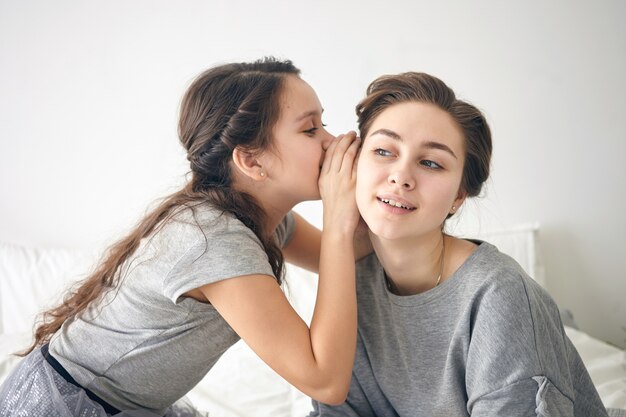 Horizontal picture of beautiful young female having curious interested look