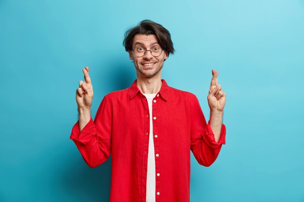 Horizontal shot of brunet cheerful man