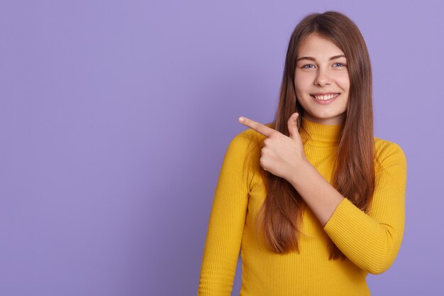 Horizontal shot of happy lady with friendly expression