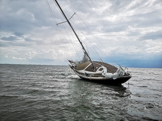 Horizontal shot of a sailboat in a sandbank in the Wangerooge island located in northern Germany