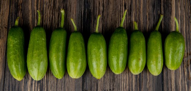 Horizontal view of cucumbers on wooden surface