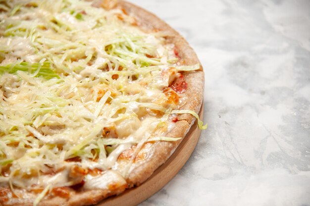 Horizontal view of delicious homemade vegan pizza on stained white surface with free space