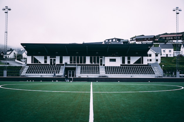 Free photo horizontal view of little football stadium on the faroe islands.