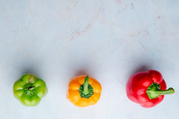 Horizontal view of peppers on white background with copy space