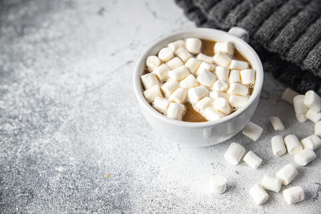 Hot chocolate marshmallow cocoa or coffee hot drink warming meal snack on the table Premium Photo