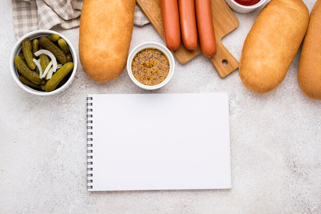 Hot dog ingredients with notebook