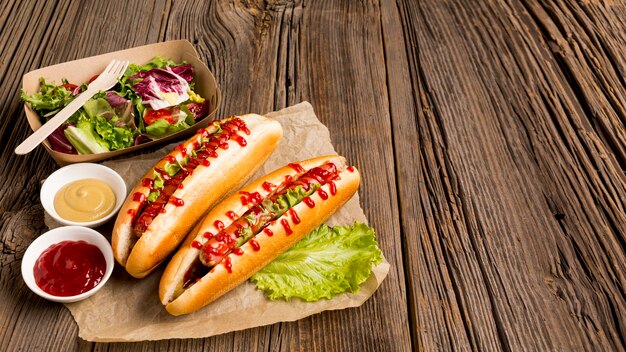 Hot dogs and small bowls with spices