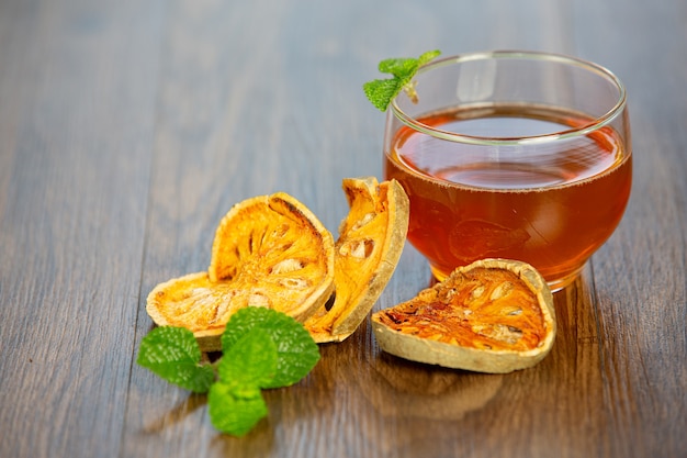 Hot dry bael fruit tea in a Thai herbal cup