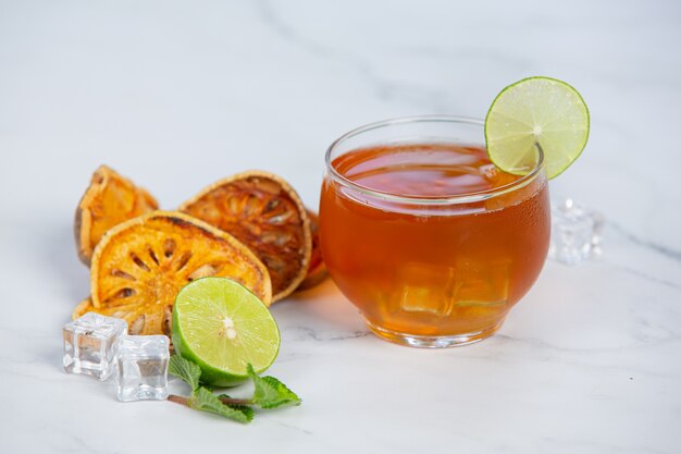 Hot dry bael fruit tea in a Thai herbal cup