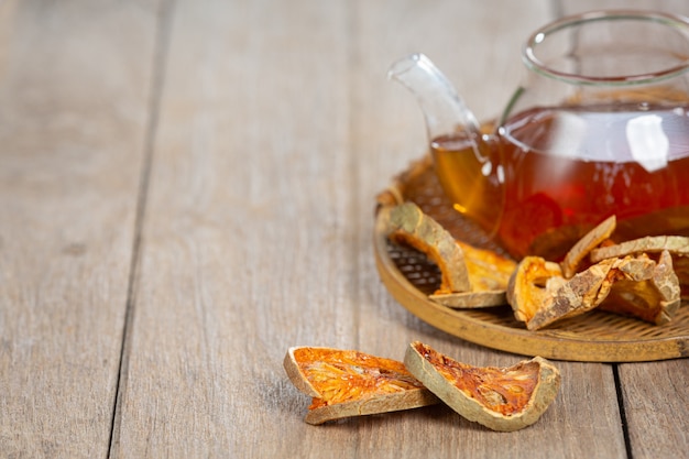 Hot dry bael fruit tea in a Thai herbal cup