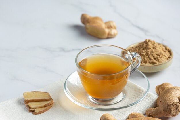 Hot ginger tea on table