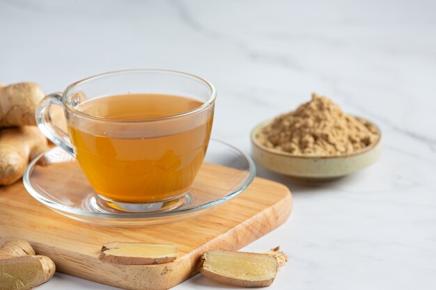 Hot ginger tea on table