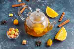 Free photo hot healthy warming winter tea with orange,honey and cinnamon.