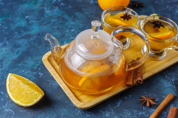 Hot healthy warming winter tea with orange, honey and cinnamon.