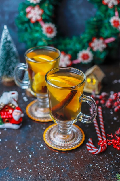 Hot healthy warming winter tea with orange, honey and cinnamon.