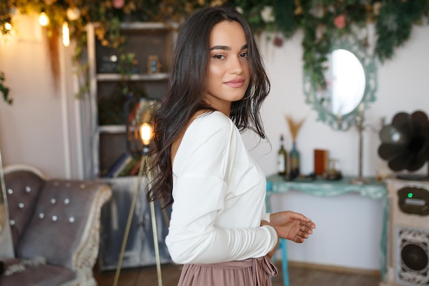 Hot lady standing on and looking at the camera at the reception High quality photo