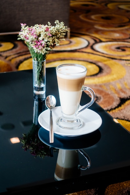 Hot latte coffee cup on table