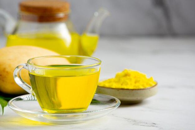 Hot mango tea on table