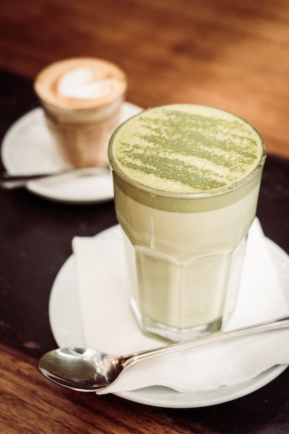Hot matcha green tea latte cup
