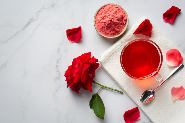 Hot rose tea on table