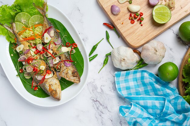 Hot and Spicy Mackerel Decorated with Thai food ingredients