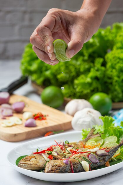 Hot and Spicy Mackerel Decorated with Thai food ingredients