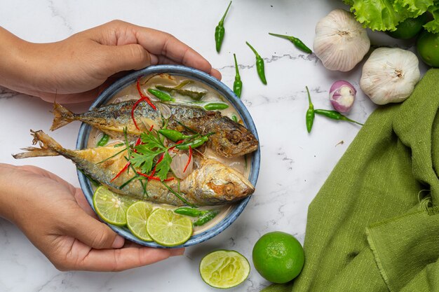 Hot and Spicy Mackerel Decorated with Thai food ingredients