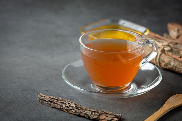 Hot tea and bark on table