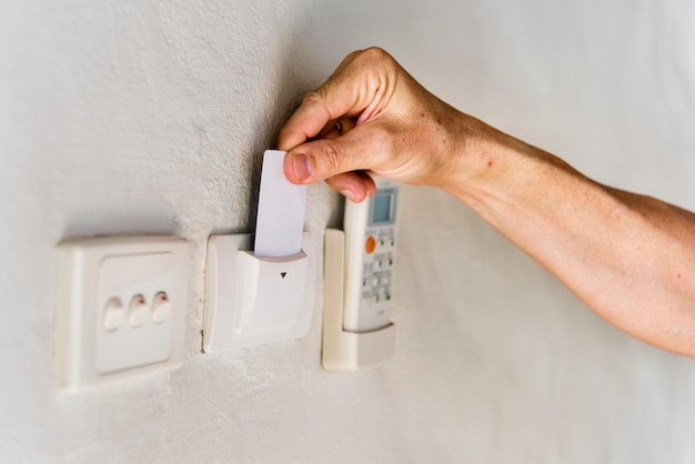 Hotel guest inserting keycard to turn the electricity on