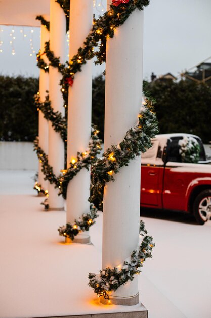 House decorated for christmas with red car
