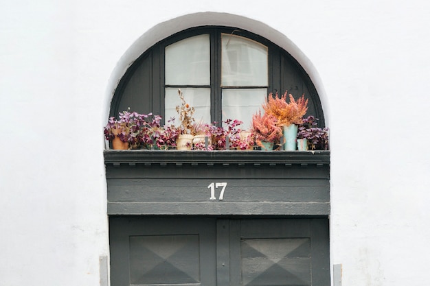 Free photo house entrance door with decorated porch