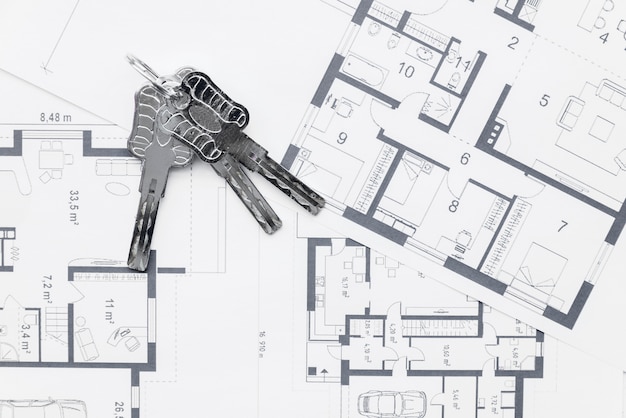 House keys on architectural blueprints plans