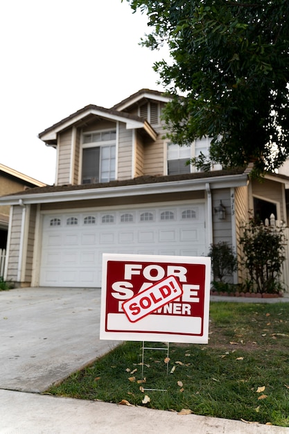 House with sold yard sign