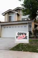 Free photo house with sold yard sign