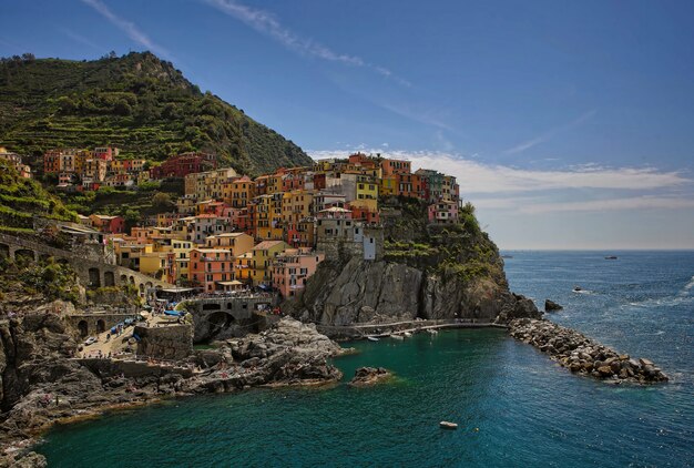 Houses on hill near body of water