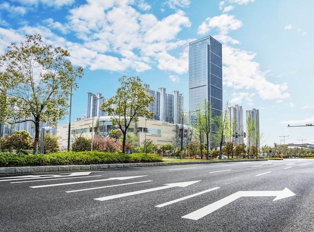 Huge buildings and tress seen from road