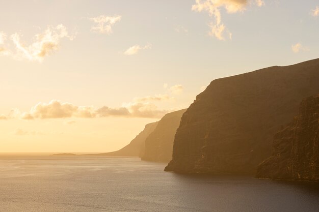 Huge cliff on the seaside sunset