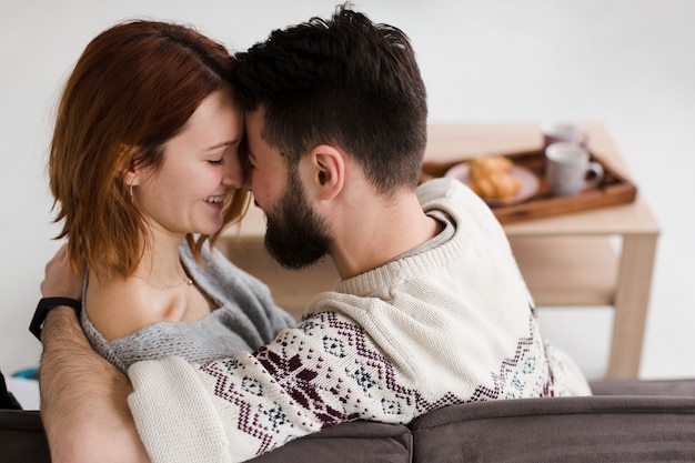 Hugging couple from behind view