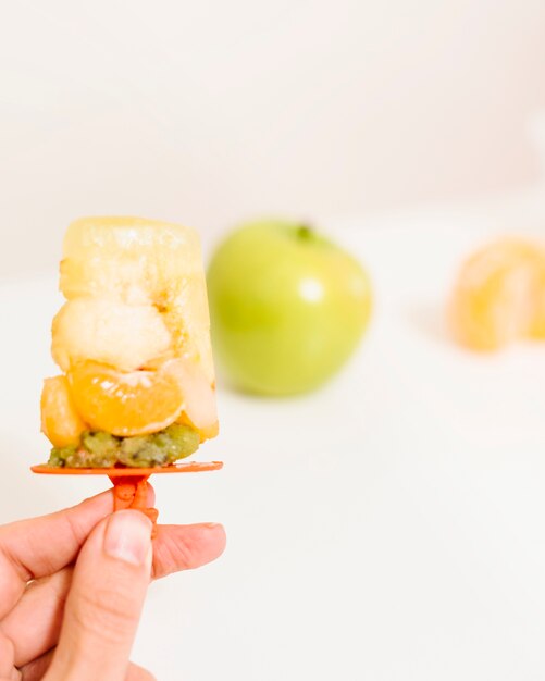 Free photo human hand holding popsicle