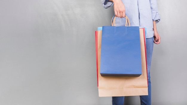 Free photo human holding shopping packages