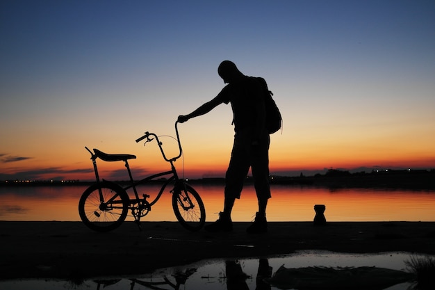 Free photo human silhouette in sunset sky