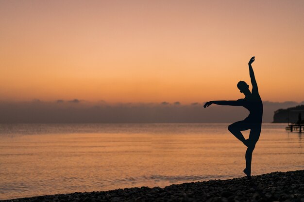 Human silhouettes outside in the dark