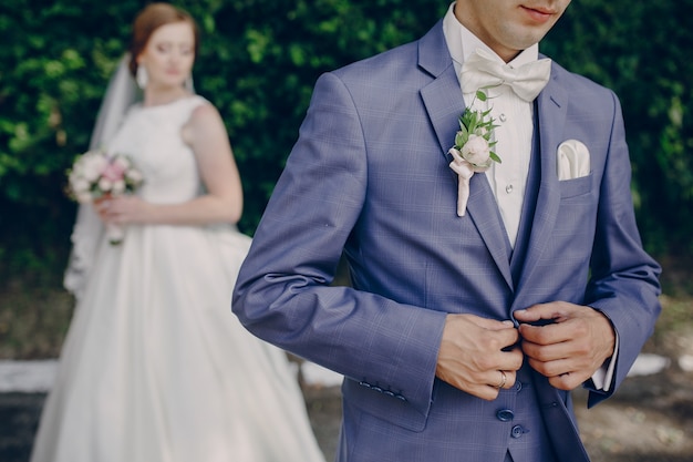 Husband clasping the suit