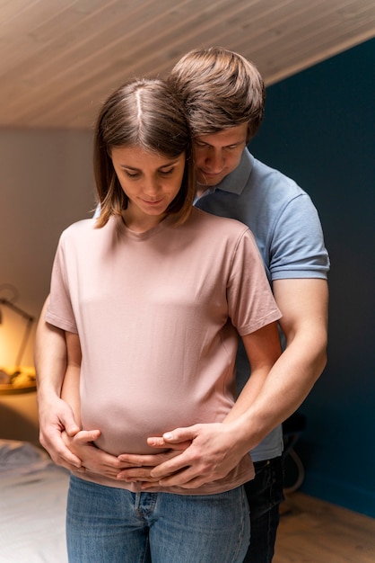 Husband holding his pregnant wife