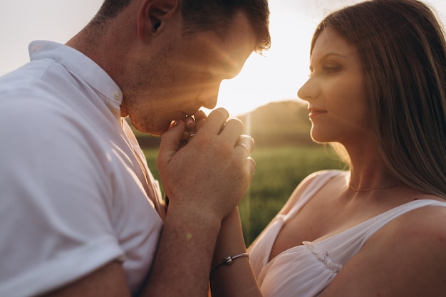 The husband kissing wife's hands