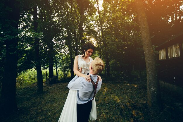 Husband lifting his wife